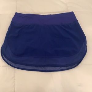 Lululemon-cobalt /navy blue tennis skirt. Size 4. With undershorts